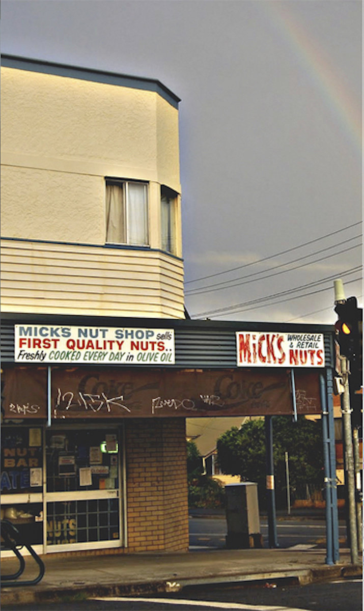 Album cover: Mick’s Nut Shop storefront at dusk with a rainbow over Hardgrave Road.