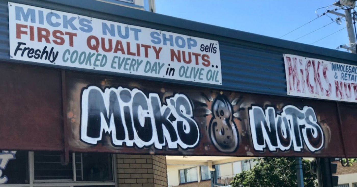 The graffiti-style storefront sign on Micks Nuts, Hardgrave Road, West End.