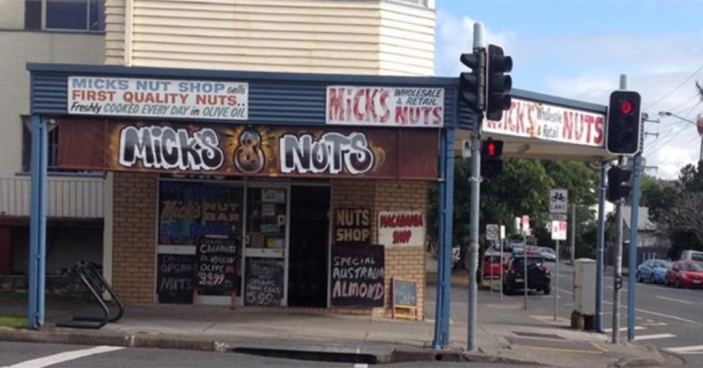 Inside Mick's Nut Shop — wooden shelves stacked with hessian sacks of nuts and dried fruit on Hardgrave Road, West End.